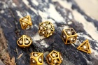 Noppasetti: Ancient Gold w/white Diamond Gems Dragons Eye Hollow Metal Dice Set (7